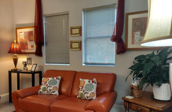 Inside the office with a comfortable couch